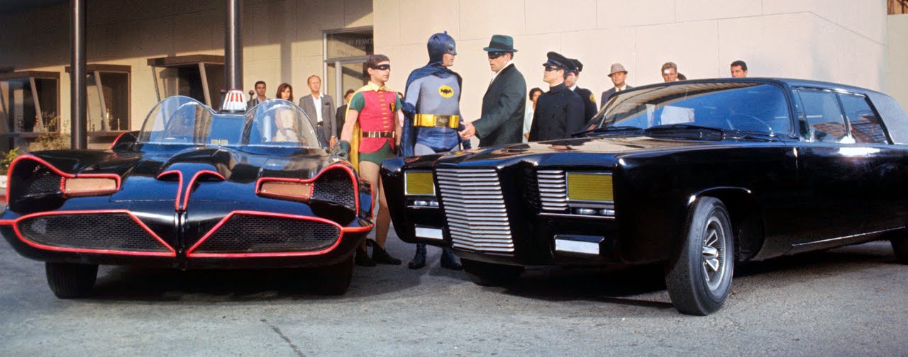 20 May 1966, Hollywood, Los Angeles, California, USA --- Holy moley and flaming fender benders, kids, this has to be the confrontation of the century! Batman, Robin, the Green Hornet and Kato meet on a corner in Gotham City during the filming of a documentary on ABC-TV's fall season productions. They are discussing the merits of the Batmobile (L) and Black Beauty, the super-cars for the superstar crimebusters. To those in the know in real life (left to right) Robin is Burt Ward; Batman is Adam West; The Green Hornet is Van Williams; and Kato is played by Bruce Lee.